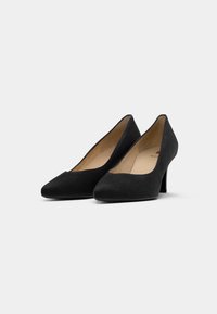 Black suede high-heeled pumps with a pointed toe design and a textured finish. Slim, moderate heel for stability and elegance.