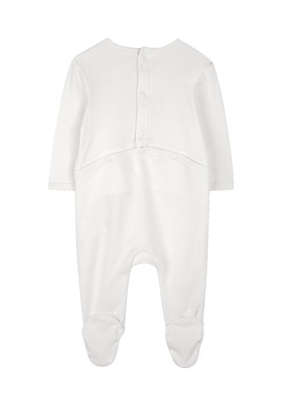 Salopette en coton blanc avec pieds, manches longues, fermeture à pressions au dos, texture lisse, design sobre et tissu doux pour le confort.