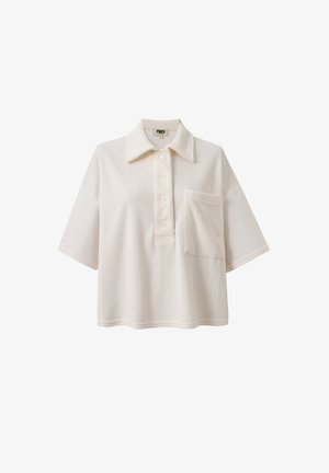 Kurzarm-Polohemd mit Kragen aus weichem, elfenbeinfarbenem Stoff. Verfügt über eine Knopfleiste und eine aufgesetzte Tasche auf der linken Vorderseite.