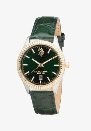 Montre-bracelet cadran vert avec lunette dorée, logo U.S. Polo Assn., fenêtre de date à 6 heures, et bracelet en cuir vert foncé.