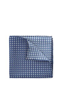 Granatowa poszetka w powtarzającym się wzorze małych białych i żółtych elementów. Gładka tekstura, złożony róg odsłaniający jaśniejszą wewnętrzną warstwę.