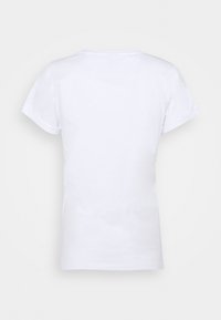 Hvid bomulds T-shirt med korte ærmer, en rund halsudskæring og en tætsiddende pasform. Bagsiden har en glat, udekoreret overflade.