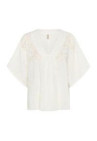 Blusa leggera bianca con scollo a V, maniche corte e dettagli in ricamo beige chiaro lungo il collo e la spalla. Tessuto testurizzato.