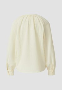 Blusa gialla chiaro con tessuto texturizzato, scollatura arricciata e maniche lunghe con polsini a bottoni. Visualizzazione della parte posteriore.