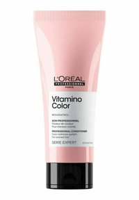 L'Oréal Professional Vitamino Color conditioner in a soft pink tube with black base, featuring white and black text label and a smooth finish.