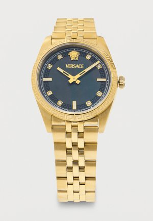Gouden Versace polshorloge met zwarte wijzerplaat, Medusa-logo, diamanten uurmarkeringen, gouden wijzers en een geschakelde metalen armband.