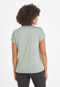 Light green short-sleeve t-shirt with a round neckline and rolled sleeves, featuring a smooth texture and curved hem detail.