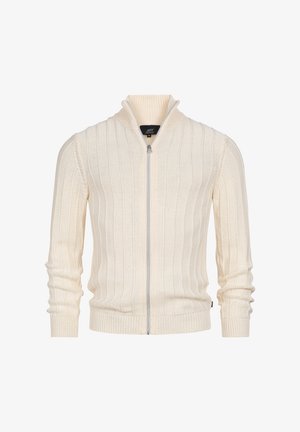 Crèmekleurige gebreide trui met rits, met een geribbelde structuur, opstaande kraag en lange mouwen. Voorzien van een zilverkleurige ritssluiting en subtiele branding.