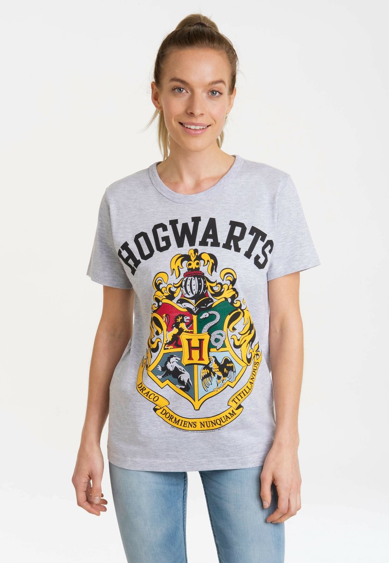 Gray cotton t-shirt featuring "HOGWARTS" in black text and a colorful crest with an "H" at the center. Short sleeves and crew neck design.