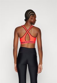 Under Armour CROSSBACK MID  - Medium support sports bra - racer red/cardinal/black