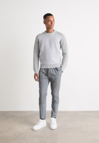 BOSS Tracksuit bottoms - dark beige