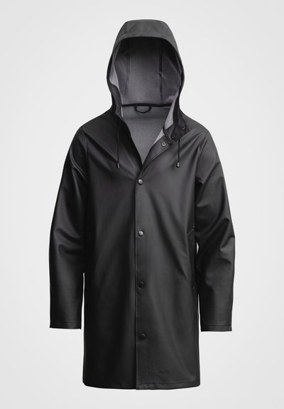 Black waterproof raincoat with a hood, snap button closure, and side pockets. Smooth texture with a modern design and minimal hardware.