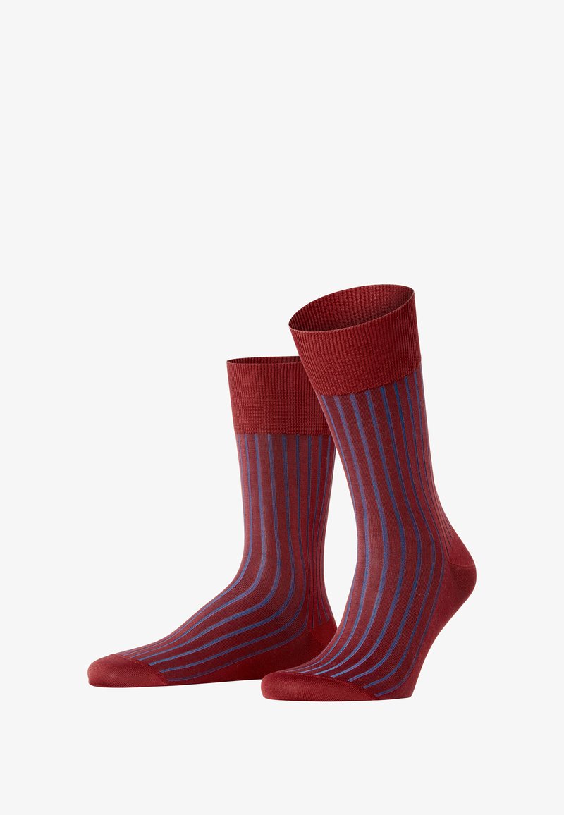 Red socks with purple and blue vertical stripes, featuring a ribbed cuff, displayed together against a white background.