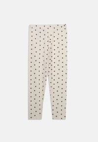 Krämfärgade leggings med bruna prickar, mjukt tyg, elastisk midjeband, smal passform och hel längd, med jämnt fördelade mönster.