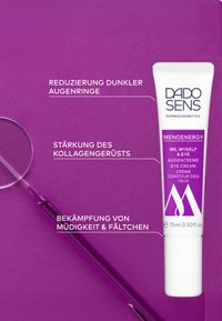 White tube of DADO SENS Me, Myself & Eye cream with purple accents and text, on a solid purple background. Accompanied by a magnifying glass.