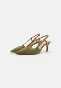 Green suede slingback heels with a pointed toe, adjustable ankle strap, and a short, sturdy heel. Smooth inner lining and minimal design.