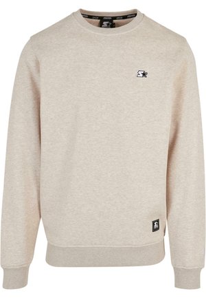 Lys beige sweatshirt lavet af tekstureret stof. Har en rund halsudskæring, ribbede manchetter og et lille sort logo på brystet.