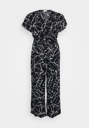 Black jumpsuit with a white abstract line pattern, short sleeves, a V-neck, and a tie waist. Fabric has a soft, textured appearance.