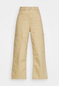 Béžové široké cargo kalhoty vyrobené z bavlny, se bočními kapsami, vysokým pasem a předním zapínáním na knoflík. Hladká textura, neformální design.