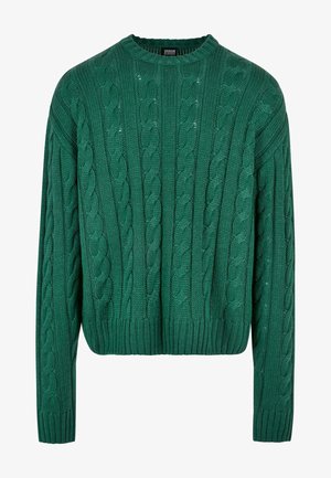 Zeleni pulover s pletenico, okrogel vrat in dolge rokave. Ima skrajšan kroj in teksturiran vzorec po celotni površini.