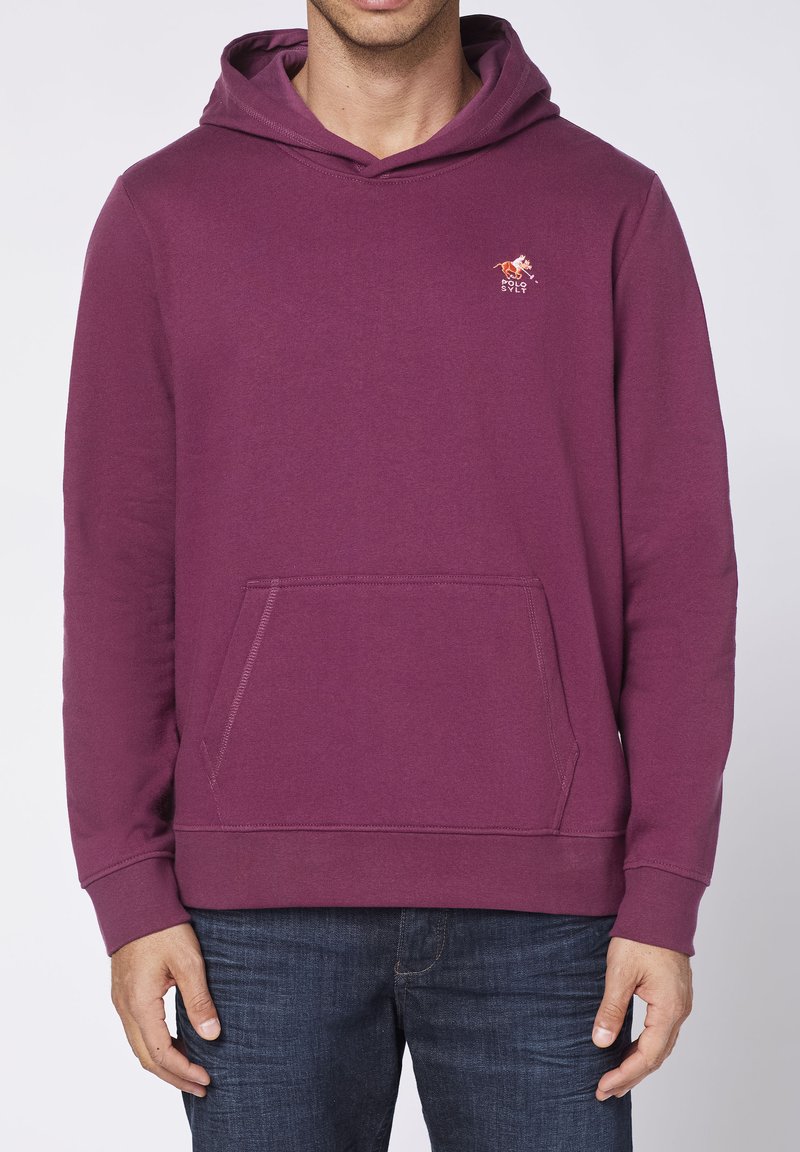 Maroon hoodie made of soft fabric, featuring a kangaroo pocket, ribbed cuffs, and a small logo accent on the chest.