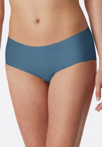 L'intimo hipster blu presenta un tessuto liscio e elastico con un design senza cuciture e senza hardware o motivi visibili.