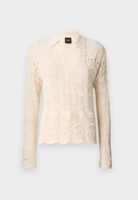 Strickpullover in Creme mit gewelltem Saum, V-Ausschnitt und langen Ärmeln, die mit einem zarten Wellenmuster und durchbrochenen Details ausgestattet sind.