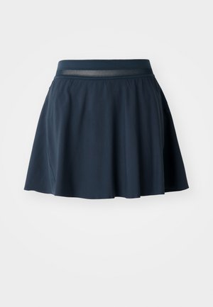 Navy skater skirt made from soft fabric, features a mesh waistband, flared silhouette, and smooth texture with a hem that falls above the knee.