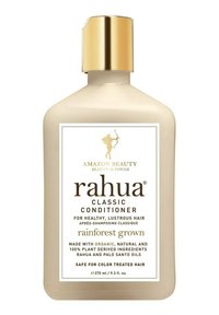 Rahua Classic Conditioner i en beige plastflaska med guldlock. Etiketten har mörk text på en vit bakgrund som lyfter fram nyckelingredienser.