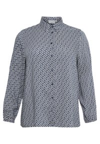 Chemise à manches longues boutonnée en bleu marine et crème avec un motif géométrique. Dotée d'un col et de manches légèrement froncées.