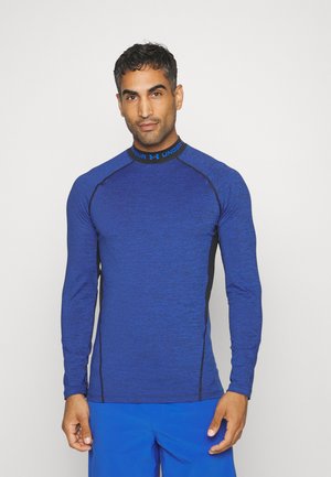Langdurige sportshirt met lange mouwen in heathered blauw met zwarte zijpanelen en een hoge hals. Met een gemerkte kraag en een gestructureerde stof.