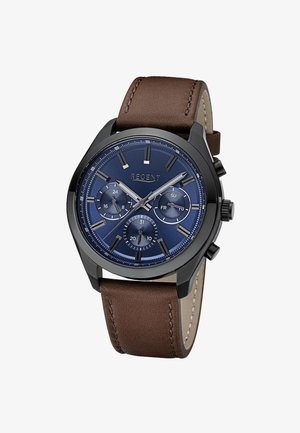 Men’s wristwatch with a blue dial, black case, three subdials showing 24-hour, day, and date, and a brown leather strap.