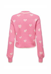 Roza pletena jopica s belimi srčnimi vzorci, skrajšan dizajn, dolgi rokavi in kremno obrobljen ovratnik ter manšete.