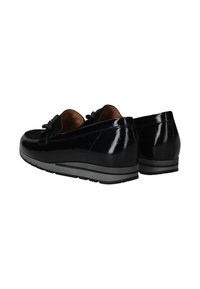 Black patent leather loafers featuring a bow accent, round toe, and a durable black rubber sole with gray stripes. Smooth finish and sleek design.