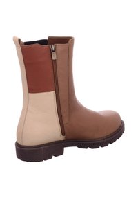 Brown leather ankle boot with a side zipper, featuring panels of dark brown and cream, textured finish, and a rubber sole.