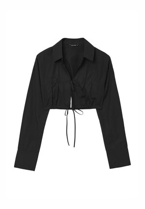 Maglietta nera cropped con maniche lunghe, colletto, frontale arricciato e dettaglio di legatura regolabile sull'orlo. Tessuto dalla consistenza liscia.
