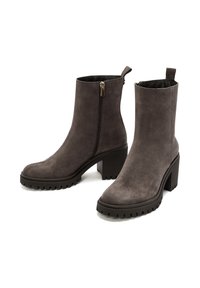 Gray suede ankle boots with a sturdy block heel, featuring a side zipper, textured rubber sole, and pull tab for easy wear.