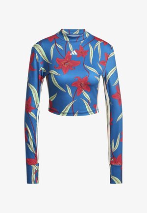 Haut court bleu à manches longues avec imprimé floral rouge, col haut, et logo Adidas blanc centré près de l'encolure.