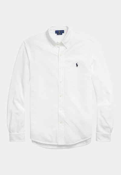 Chemise blanche à manches longues avec boutons, col boutonné et petit logo Polo Ralph Lauren foncé sur la poitrine gauche.