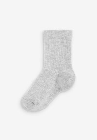 Calzino grigio realizzato in morbido tessuto a coste. Design alla caviglia con punta arrotondata e tallone rinforzato. Nessun motivo o accento visibile.