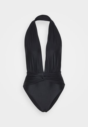 Maillot de bain noir à col halter avec un décolleté en V profond, détail de taille nouée et tissu lisse et extensible. Couverture complète à l'arrière.