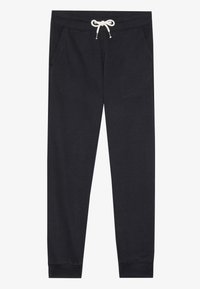 Pantaloni jogger din bumbac de culoare gri închis, având un brâu elastic cu șnur alb, buzunare laterale și manșete ajustate la glezne.