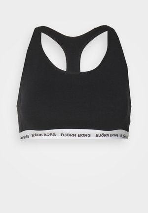 Svart sportsbh med racerback-design. Har et hvitt bånd nederst med "BJÖRN BORG" trykket i svart. Myk, elastisk stoff.
