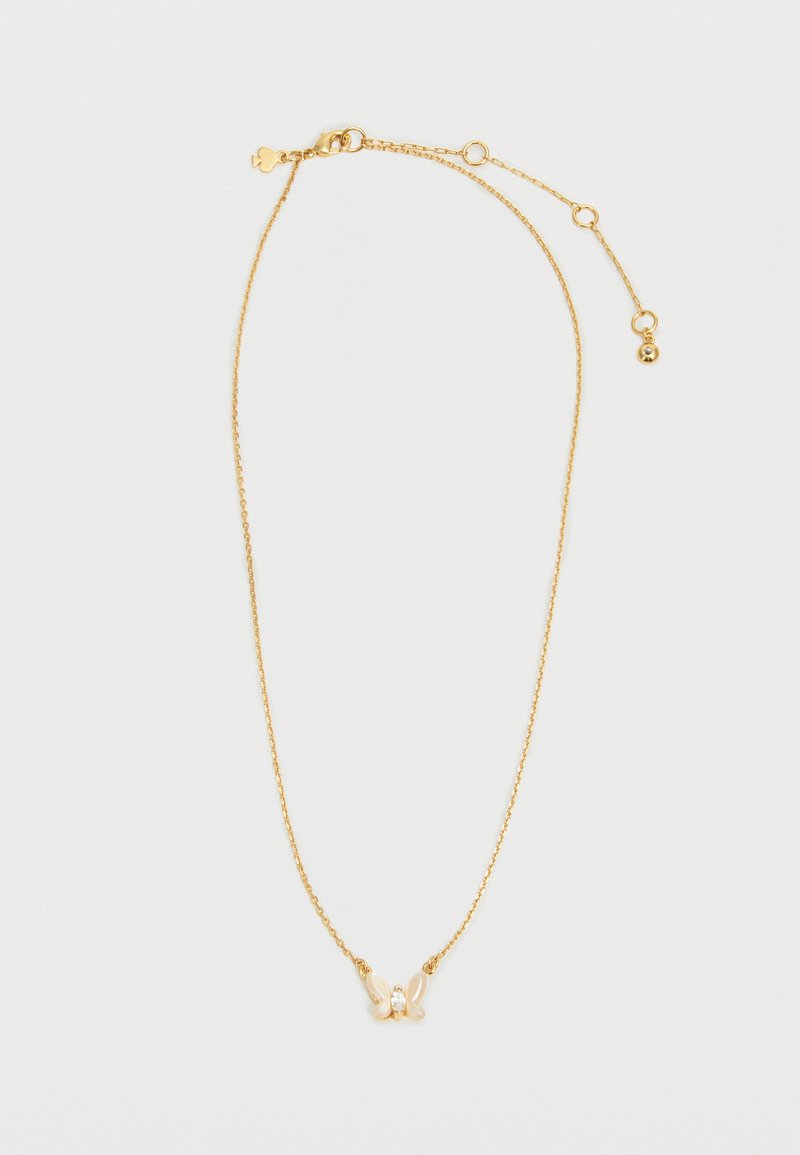 Õrn kuldne kett-kaelakee väikese liblikariipusega, millel on valged ja läbipaistvad kivikujud, reguleeritav kinnis koos pikenduslinkidega.