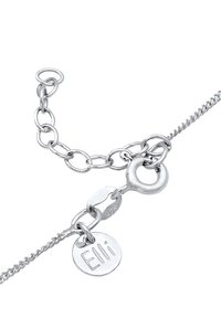 Sølv armbåndet har et kædedesign med en rund tag med indgraveringen "Elli" og en lille lobsterlås. Materialet er mærket 925 sterling sølv.