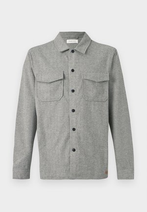 Hall hallimustriga pika varrukaga särkjakk mustade nööpidega, kahe esiklapiga taskuga ja väikese brändimärgiga ääre lähedal.