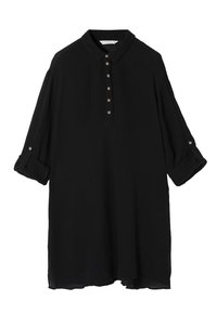Black button-up shirt made of textured fabric, featuring a collar, rolled sleeves, and a slightly curved hem. Six matching buttons detail the front.