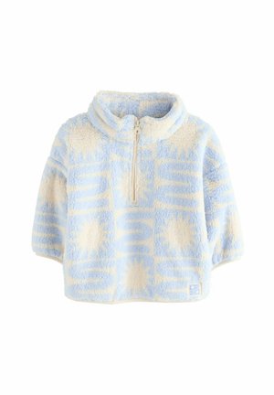 Sudadera de forro polar azul claro con cuello alto, media cremallera y patrones geométricos en color crema. Mangas cortas y forma cuadrada.