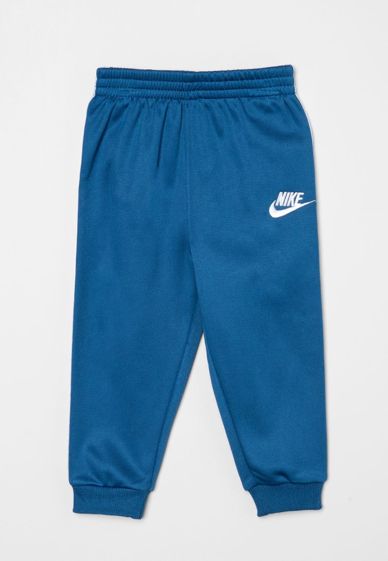 Pantalones de chándal Nike azules, fabricados con material suave, que presentan una cintura elástica, piernas ajustadas y un destacado logo blanco en la parte frontal.
