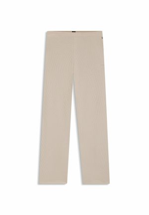 Beige våffelstickade vida byxor med elastisk midja, utlagda på en vit bakgrund.